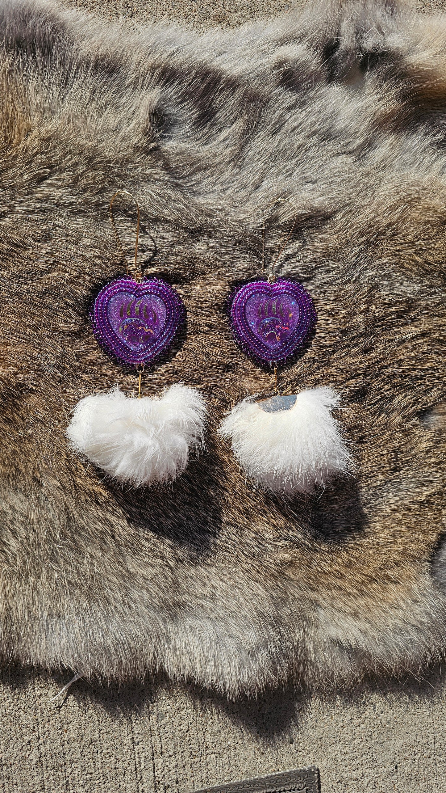 Purple beaded bear claw with rabbit fur pompom