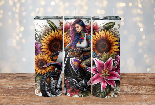 Tattoo girl with sunflowers riding a dirt bike