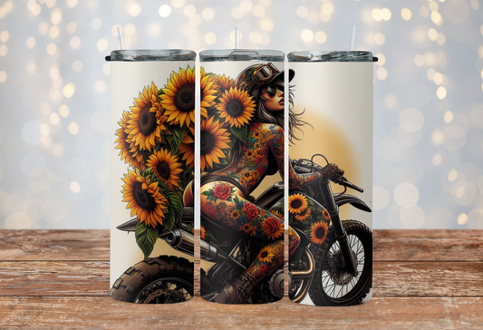 Tattoo girl riding motorcycle with sunflowers